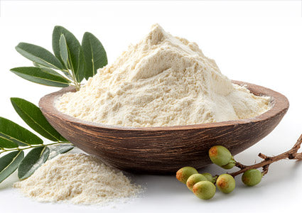 Acacia Gum Powder in wooden bowl filled with white powder, surrounded by green leaves and branches on a white background