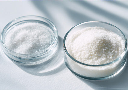 two glass bowls filled with Vitamin C powder on a light surface